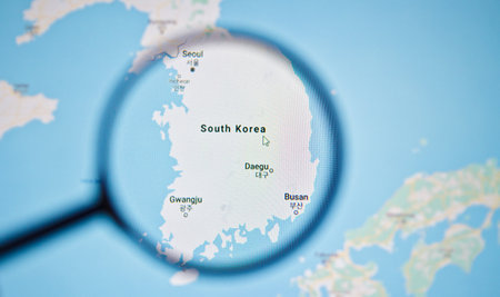 UKRAINE, ODESSA - APRIL 25, 2019: South Korea on google maps through magnifying glassのeditorial素材