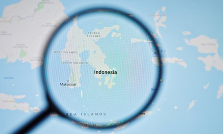 UKRAINE, ODESSA - APRIL 25, 2019: Indonesia on google maps through magnifying glassのeditorial素材