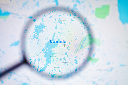 UKRAINE, ODESSA - APRIL 25, 2019: Canada on google maps through magnifying glass