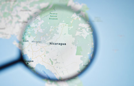 UKRAINE, ODESSA - APRIL 25, 2019: Nicaragua on google maps through magnifying glassのeditorial素材