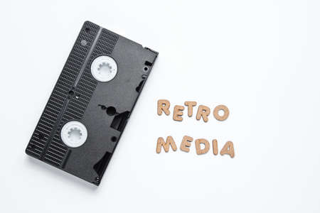 Video cassette on white background with words retro media. Top viewの写真素材