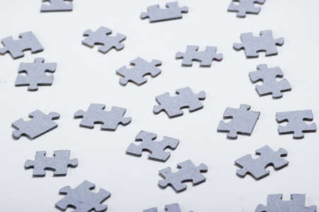 Many particles of a puzzle on a white backgroundの写真素材