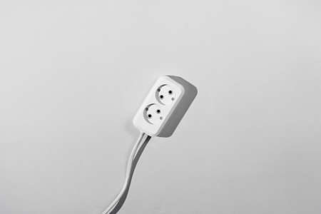 Power outlet extension on a gray background close-up