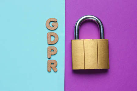 Lock and word GDPR on blue pink paper background. Top viewの写真素材