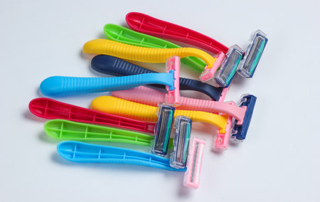 Many colored plastic razors on white background close upの写真素材