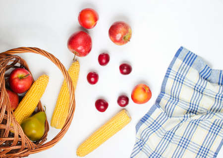 Picnic setting with fruit on white background. Rustic style junket.の写真素材