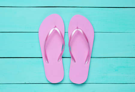 Tropical beach lifestyle. Flip flops on blue wooden background. Summer background. Top viewの写真素材