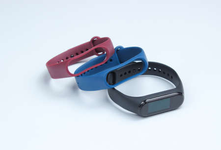 Smart watch with interchangeable bracelets on white background. Fitness tracker. Modern gadgetsの写真素材