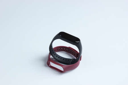 Smart watch with interchangeable bracelets on white background. Fitness tracker. Modern gadgetsの写真素材