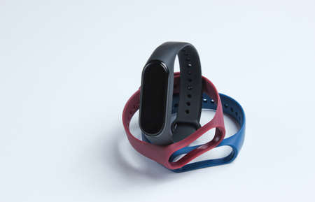 Smart watch with interchangeable bracelets on white background. Fitness tracker. Modern gadgetsの写真素材