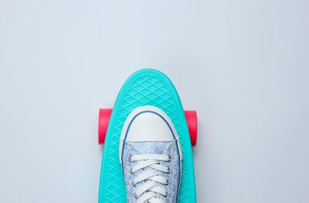 Hipster sneakers on skateboard top view on background. Minimalism lifestyle concept.Copy spaceの写真素材
