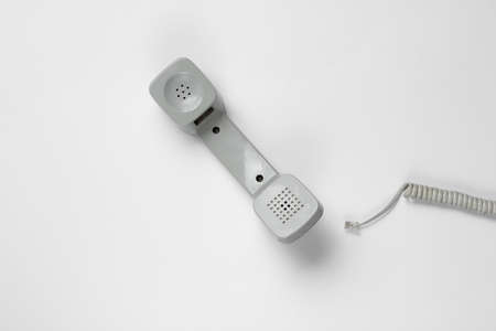Reto handset phone with cable on white background. Call center. Hotline. Top viewの写真素材