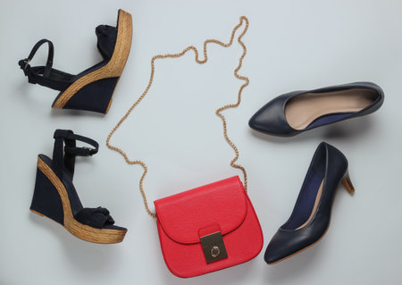 Minimalistic fashion still life. Classic women's high heel shoes, sandals with platform, red leather...