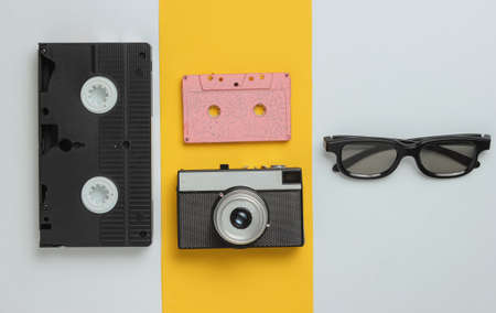 Entertainment and media 80s. Pop culture objects on a colored paper background. Top view. Minimalismの写真素材