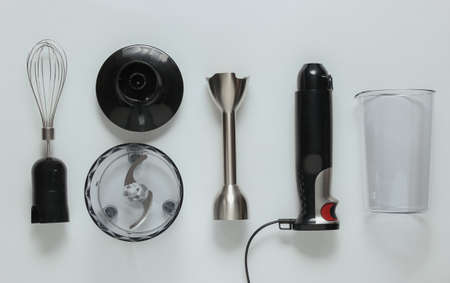 Electric hand mixer. Set of nozzles and containers for blender on white background. Top view, flat layの写真素材