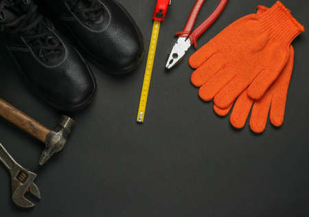 Flat lay composition with different industrial working tools and instruments, safety equipmen on yelow background. Copy space. Top viewの写真素材