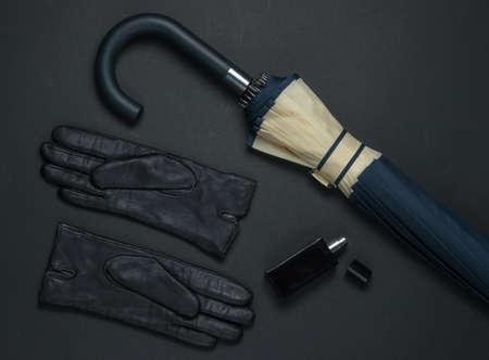 Women's fashion accessories. Leather gloves, perfume bottle, umbrella. Top viewの写真素材