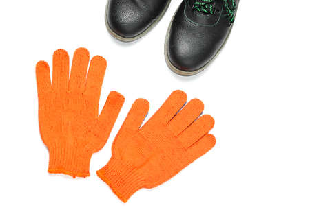 Leather work boots and gloves isolated on white background. Worker safety