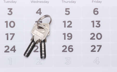 Payment of rent for housing. House keys on the calendar.の写真素材