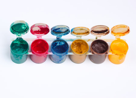 Gouache bottles of paint on white background.の写真素材