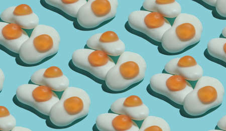 Pop art background. A lot of marmalade fried eggs on blue pastel background. Minimalism food still lifeの写真素材