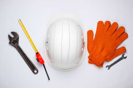 Safety equipment and work tool on a white background. Top view