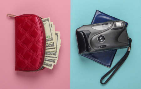 Flat lay design of travel concept with wallet, passport, camera. Pink blue pastel background. Minimalism. Top viewの写真素材