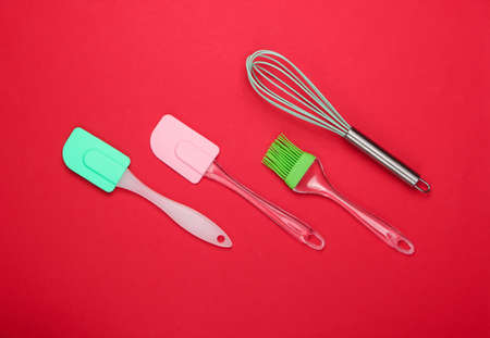 Flat lay compoisition of kitchen tools on red background. Minimalism. Top viewの写真素材