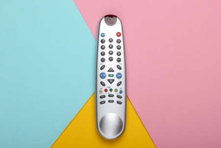 Tv remote control on a pastel colored background. Top viewの写真素材