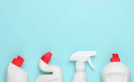 Bottle of detergent on blue pastel background. House cleaning concept. Minimalism. Top view. Copy spaceの写真素材