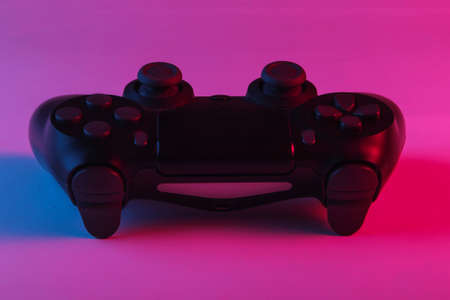 Gamepad with neon blue-pink light. Gaming concept.