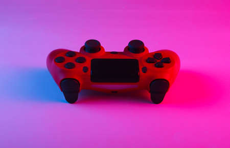 Gamepad with neon blue-pink light. Gaming concept.