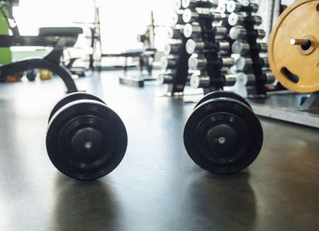 Two heavy dumbbells close-up in the gymの写真素材