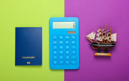 Calculation of the cost of the cruise. Travel concept. Calculator, passport, ship figurine on a...