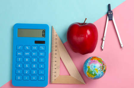 Back to school. School and office supplies on blue pink pastel background. Educational, study concept. Top view.の写真素材