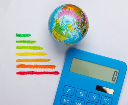 Energy efficiency rating, globe and calculator on a white background. Top view. Eco conceptの写真素材