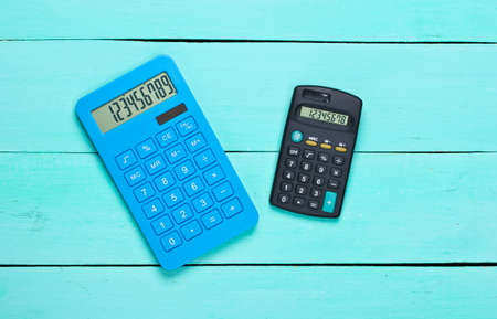 Two Calculators on blue boards. Top viewの写真素材