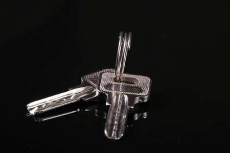 Metal keys on a black background close-upの写真素材
