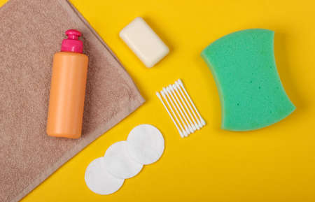 Beauty, health care, cosmetics, hygiene product on yellow background. Flat lay. Top viewの写真素材