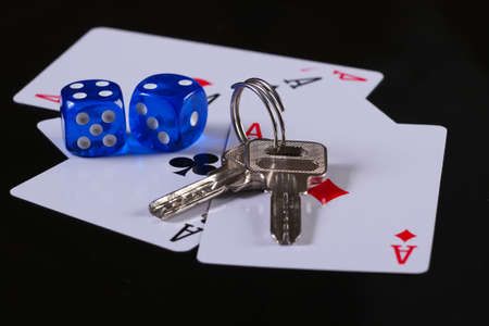 Four aces with dices and house keys on a black background. Everything is at stake. Gamblingの写真素材