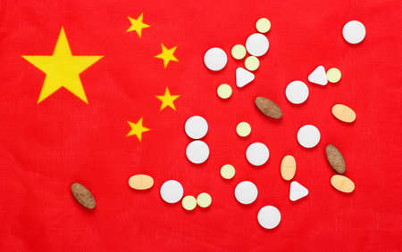 Pills with flag of China. Pandemic covid-19の写真素材