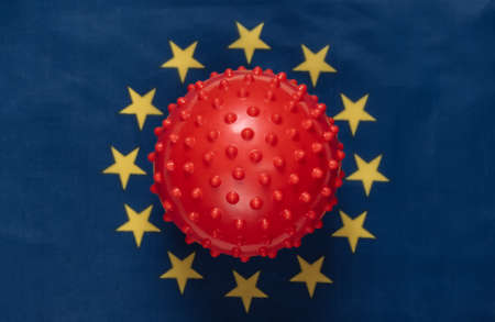 Covid-19 virus strain mockup on Euro Union flag backgroundの写真素材