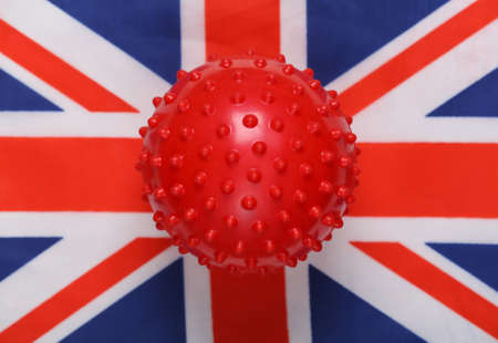 Covid-19 virus strain mockup on Great Britain flag backgroundの写真素材