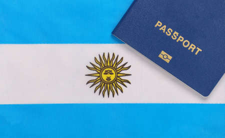 Travel concept. Passport against the background of Argentina flagの写真素材