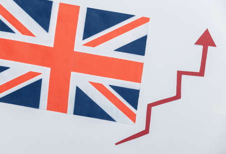 British flag with red growth arrow. Arrow graph going up. The economic growthの写真素材