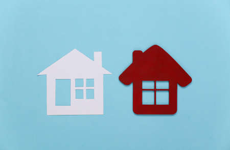 Two house figure on blue background.の写真素材