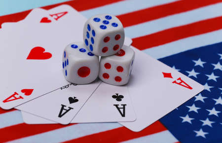 Four aces and dice on the background of the USA flag.の写真素材