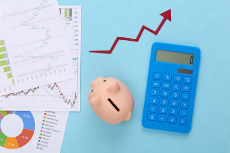 Growth upward arrow, graphs and charts, piggy bank and calculator on blue background. Business...