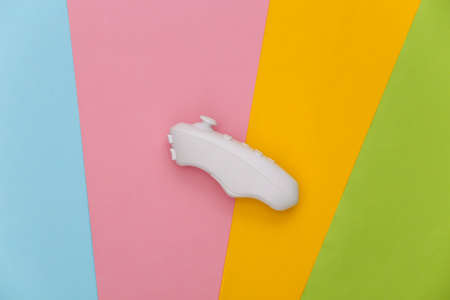 Modern joystick on colored background. flat lay. top view
