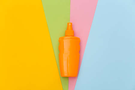 Sunblock bottle on colored background. skin protection. beach holidays. top viewの写真素材
